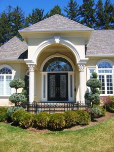 Picture of a beautiful house with double front doors.